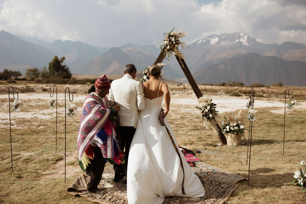 Peruvian wedding ceremony featuring the bride and groom in the mountains of Peru