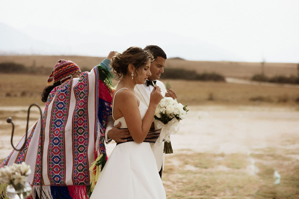 Peruvian wedding ceremony featuring the bride and groom in the mountains of Peru