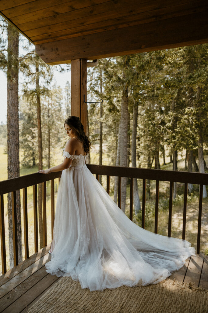 bridal portrait of bride outside with her long wedding dress on