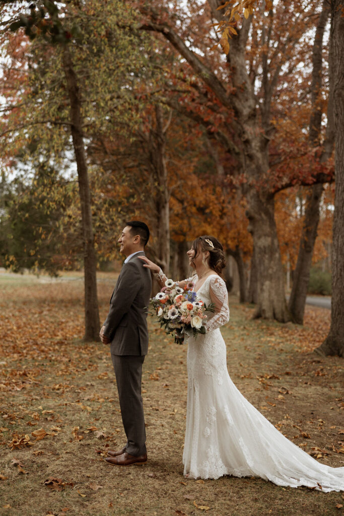 bride and groom first look at their outdoor fall wedding