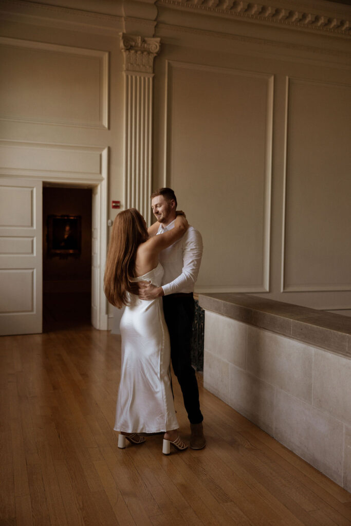 couple dancing together at their engagement session at the VMFA